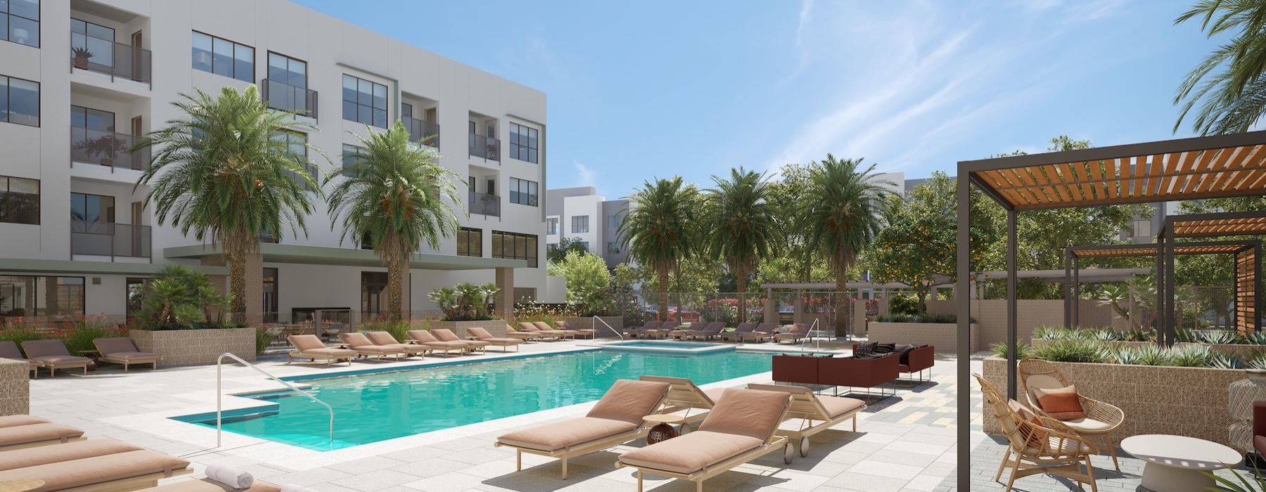 a swimming pool with lounge chairs and a building in the background