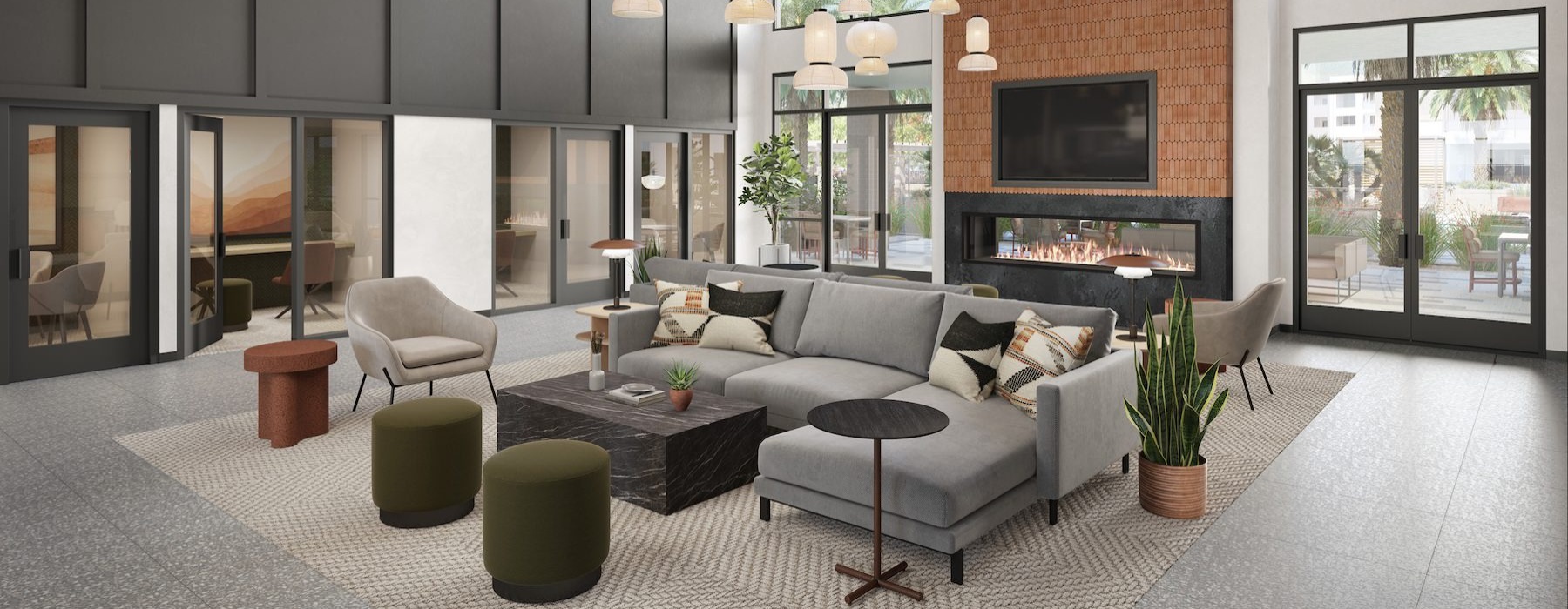 a clubroom with a couch, a fireplace and a tv